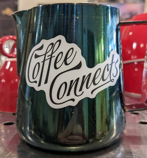 Coffee Connects sticker on an 8oz milk pitcher