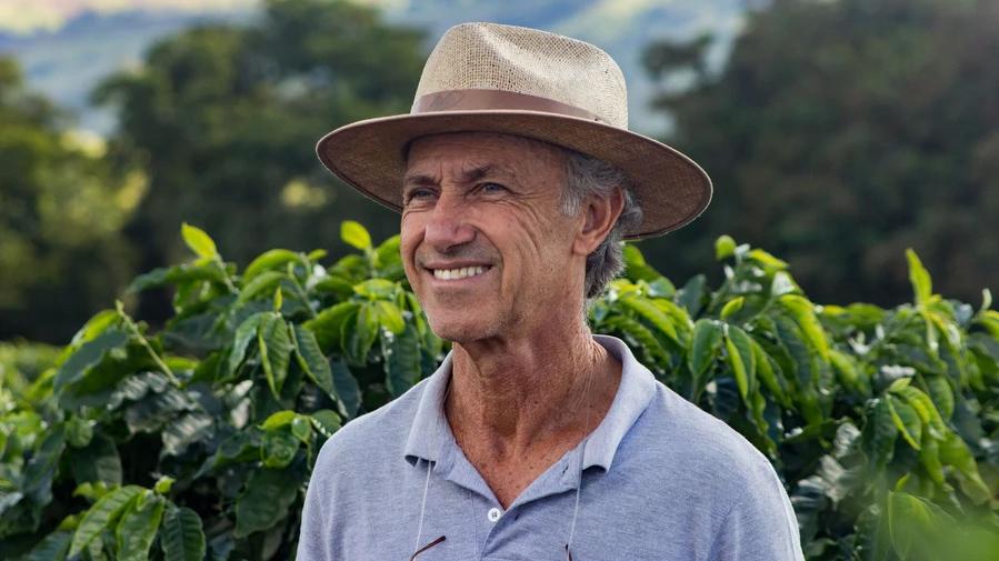 Danillo Barbosa - Farmer standing in front of coffee plants